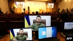 Ukrainian President Volodymyr Zelenskyy addresses South Korean parliamentary via video link at national assembly in Seoul, April 11, 2022.