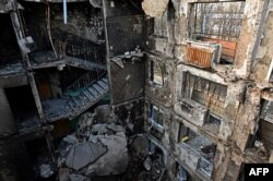 A partially destroyed five-story residential building is seen in the Ukrainian city of Kharkiv, April 10, 2022, amid the Russian invasion of Ukraine.