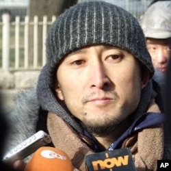 Yang Licai , 38,was one of thousands of Chinese citizens who signed "Charter '08." Yang came to the courthouse on Friday, the day of Liu Xiaobo's sentencing, to turn himself in to authorities in solidarity with the convicted dissident.