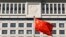 FILE - A Chinese national flag billows in front of Shandong Province Supreme People's Court in Jinan, eastern China, Oct. 24, 2013. Activists are calling on U.S. officials to put more focus on human rights in bilateral talks with China.