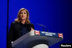 FILE - British Leader of the House of Commons Penny Mordaunt speaks on stage during the annual Conservative Party conference in Birmingham, Britain, Oct. 2, 2022.