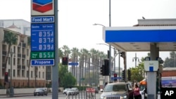 Gas prices are advertised at a gas station Oct. 6, 2022, in Los Angeles. 
