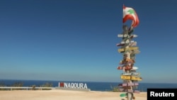 Signs bearing names of cities are pictured in Naqoura, near the Lebanese-Israeli border, southern Lebanon, Oct. 6, 2022. 