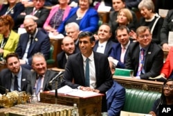 In this handout photo provided by UK Parliament, Britain's Prime Minister Rishi Sunak speaks during Prime Minister's Questions in the House of Commons in London, Oct. 26, 2022.