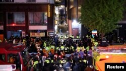 Rescue team and firefighters work at the scene of a deadly crowd surge during a Halloween festival in Seoul, South Korea, Oct. 30, 2022.