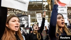 People participate in a protest against the Islamic regime of Iran and the death of Mahsa Amini in New York City, Sept. 27, 2022.