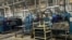 Employees work at Associated Battery Manufacturers (EA) Ltd., on Kampala Road, Industrial Area in Nairobi, Kenya, Oct. 4, 2022. The company exported its first locally made batteries to Ghana a few weeks ago. (Mariama Diallo/VOA) 