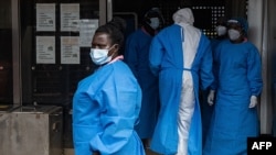 Medical staff members in protective gear are seen at Mubende Regional Referral Hospital, in Mubende, Uganda, Sept. 24, 2022.