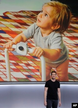 Google's Juston Payne talks about the Google Clips camera at a Google event at the SFJAZZ Center in San Francisco, Wednesday, Oct. 4, 2017. (AP Photo/Jeff Chiu)
