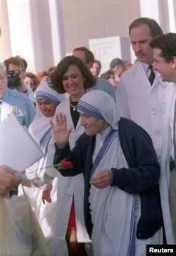 FILE - Mother Theresa leaves Scripps Clinic in San Diego California with her primary doctor Patricia Aubanel (L) Janurary 15, 1992. She will continue her recuperation in Tijuana, Mexico after her hospital stay to treat pneumonia and heart problems.