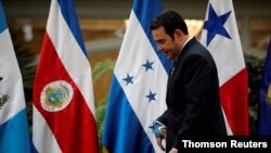 FILE PHOTO: Guatemala's President Jimmy Morales is seen before a family photo during a meeting of the Central American Integration System in Guatemala City