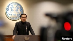 FILE - Thai Prime Minister Prayuth Chan-ocha attends a news conference as the junta marked the third anniversary of a military coup in Bangkok, Thailand, May 23, 2017. 
