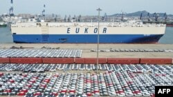 This aerial photo taken April 13, 2022, shows cars that will be exported at Yantai port, in China's eastern Shandong province.