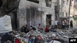 资料照片：加沙南部拉法城的苏尔坦社区遭到以色列空袭。（2024年5月20日）