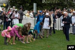 US President Joe Biden and First Lady Jill Biden take part in the annual White House Easter Egg Roll on the South Lawn of the White House in Washington, DC, Apr. 18, 2022.