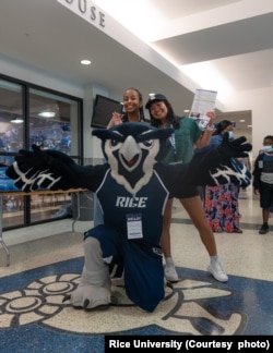 Students visited Rice University and posed with the school's mascot, an owl, during the recent Owl Days.