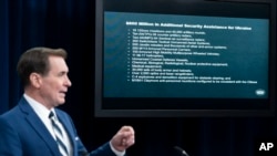 Pentagon spokesman John Kirby discusses a list of security items the U.S. is providing to Ukraine during a media briefing at the Pentagon, April 13, 2022. 
