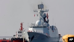 A type 054A guided missile frigate "Wuhu," prepares to dock at Manila's South Harbor for a four-day port call Thursday, Jan. 17, 2019 in Manila