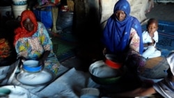 Women sift ground maize in a former warehouse where they live in Kawar Maila, a camp in Maiduguri, capital of northeastern Nigeria’s Borno state. (Haruna Shehu/VOA)