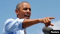 U.S. President Barack Obama speaks during a visit to the Port of Wilmington in Wilmington, Delaware about the economy and the Malaysian airliner brought down over eastern Ukraine Thursday, killing all 298 people aboard, July 17, 2014.