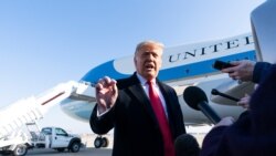 President Donald Trump speaks with reporters before boarding Air Force One Jan. 12, 2021, at Andrews Air Force Base, Maryland, to travel to Texas.