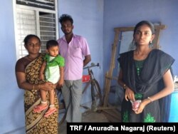 Garment worker Muthulakshmi Mariappan (right) with her brother and sister in their home in N Pudur village in southern Indian state of Tamil Nadu, July 27, 2017.