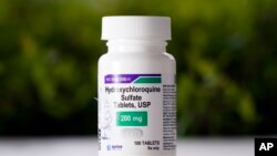 This April 7, 2020 photo shows a bottle of hydroxychloroquine tablets in Texas City, Texas. 