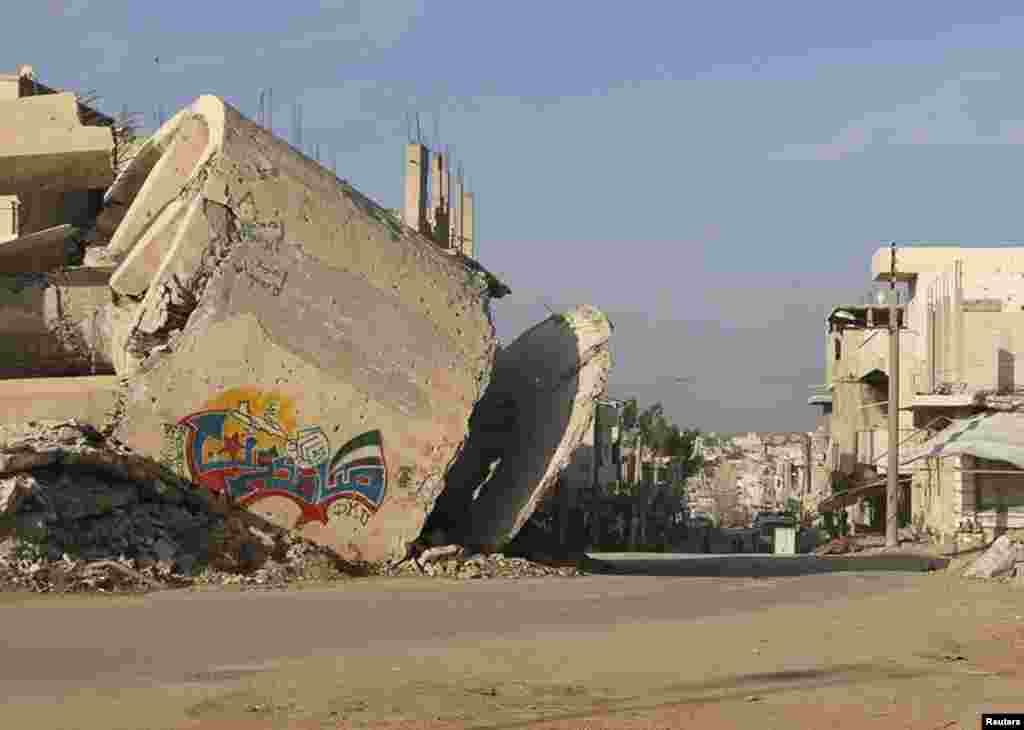 The word &quot;Steadfast&quot; is seen on a graffiti on a damaged building in al-Manshiyeh neighborhood in Deraa, Dec. 7, 2014.