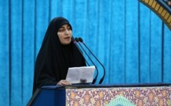 A handout picture provided by the office of Iran's Supreme Leader Ayatollah Ali Khamenei shows Zeinab Soleimani, daughter of slain Iranian military commander Qasem Soleimani speaking during his funeral, in Tehran, Jan. 6, 2020.