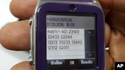 This May 8, 2016 photo by Asst. Prof. Pakarat Jumpanoi shows a smartwatch used by students caught cheating in exams for admission to medical and dental faculties in Bangkok, Thailand. 