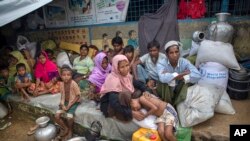 Rohingya Muslims, who crossed over from Myanmar into Bangladesh, rest inside a school compound at Kutupalong refugee camp, Bangladesh, Oct. 23, 2017.