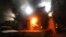 FILE - The U.S. Consulate in Benghazi is seen in flames during a protest by an armed group said to have been protesting a film being produced in the United States, Sept.11, 2012. 