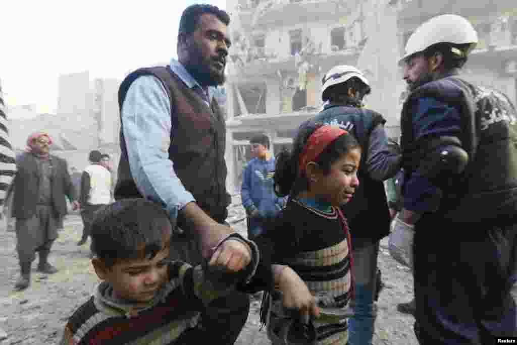 A young girl cries at a site hit by what activists said were barrel bombs dropped by government forces, Aleppo, Syria, Jan. 29, 2014.&nbsp;