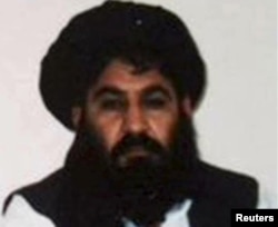 FILE - Mullah Akhtar Mansoor, leader of the Afghan Taliban, is seen in this undated handout photo from the Taliban.