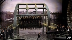 Common and John Legend perform at the Oscars with the Edmund Pettus Bridge on the set.