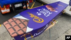 This photo provided by Ross Hall shows a casket designed to look like a chocolate bar in Auckland, New Zealand, on April 30, 2020. (Ross Hall via AP)