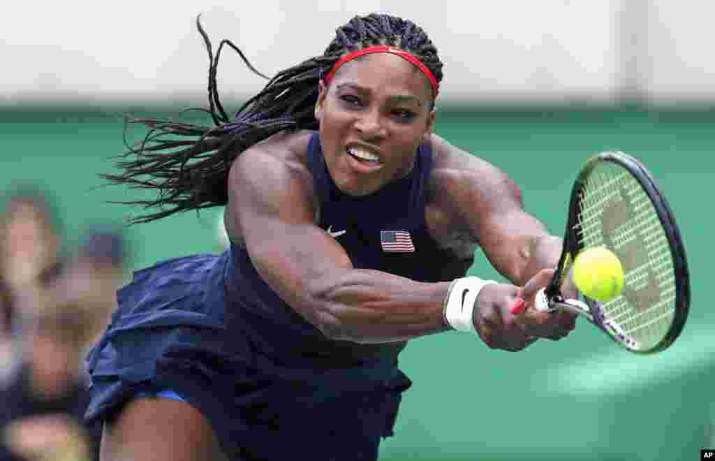 Serena Williams, of the United States, reaches for a return against Daria Gavrilova, of Australia, at the 2016 Summer Olympics in Rio de Janeiro, Aug. 7, 2016.
