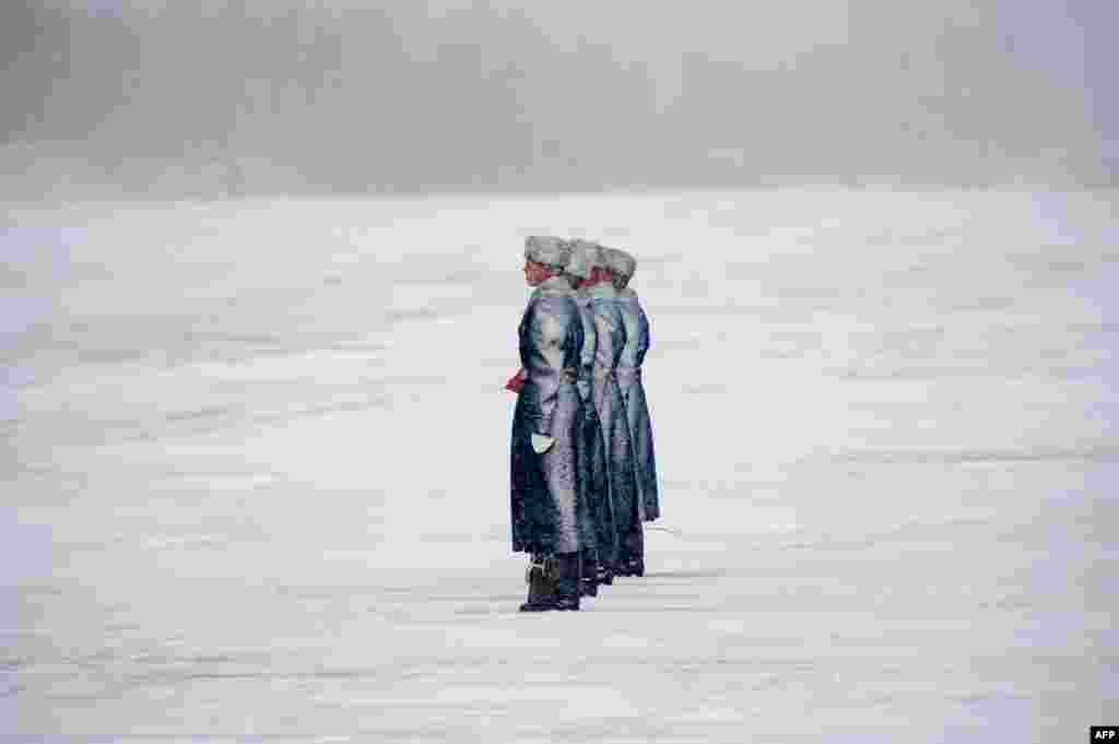 Belarus' honor guards attend a turnover ceremony of 6 Mi-8MTV-5 helicopters purchased from a Russia's manufacturer at a military base outside Minsk.