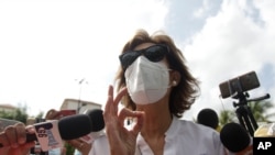 FILE - Cristiana Chamorro, one of Nicaragua’s main presumptive presidential candidates, talks to reporters in Managua, Nicaragua, May 21, 2021. .