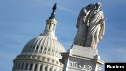 The figures of Grief and History stand atop the Peace Statue near the U.S. Capitol, Jan. 20, 2018. President Donald Trump and the U.S. Congress failed to reach a deal on funding federal agencies in Washington.