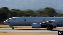 A U.S. Navy P-8 Poseidon takes off from Perth Airport on route to rejoin the on-going search operations for the missing Malaysia Airlines Flight 370 in Perth, Australia, Apr. 10, 2014.