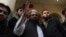 Hafiz Saeed, head of the Pakistan's Jamaat-ud-Dawa group waves to supporters at a mosque in Lahore, Pakistan, Nov. 24, 2017.