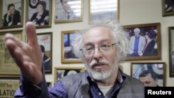 FILE - Alexei Venediktov, editor-in-chief of Russian radio station Ekho Moskvy, makes a statement after an intruder attacked the station's anchor Tatyana Felgengauer in Moscow, Russia October 23, 2017. 