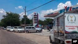 Long lines of vehicles wait at a filling station Tuesday, April 19, 2022, in Yangon, Myanmar. (AP Photo)