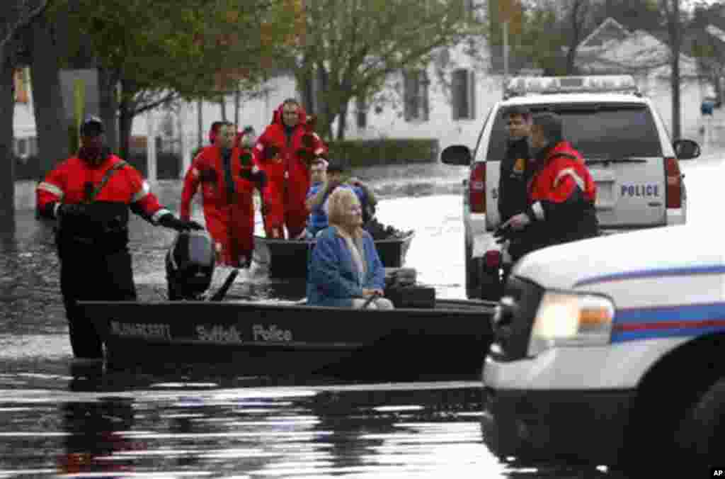 Elaine Belviso, 72, is rescued from her flooded home by Suffolk County police after being trapped there overnight by superstorm Sandy, October 30, 2012, in Babylon, New York.