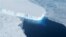 This undated handout photo provided by NASA shows the Thwaites Glacier in West Antarctic. Two new studies indicate that part of the huge West Antarctic ice sheet is starting a slow collapse in an unstoppable way. Alarmed scientists say that means even mor