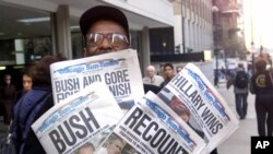 In this Nov. 8, 2000 photo, newspaper headlines reflect the suspense, drama and changes in following the presidential race between Vice President Al Gore and Texas Gov. George W. Bush.
