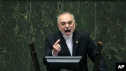Head of Iran's Atomic Energy Organization Ali Akbar Salehi speaks in an open session of parliament while discussing a bill on Iran's nuclear deal with world powers, in Tehran, Iran, Oct. 11, 2015.