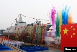 FILE - China's domestically-built destroyer, a 10,000-tonne warship, is seen during its launching ceremony at the Jiangnan Shipyard in Shanghai, China, June 28, 2017.