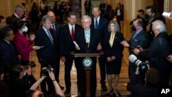 Senate Minority Leader Mitch McConnell of Kentucky talks with reporters at the Capitol, April 5, 2022.